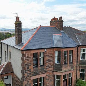 grey slate roof in glasgow with red ridges